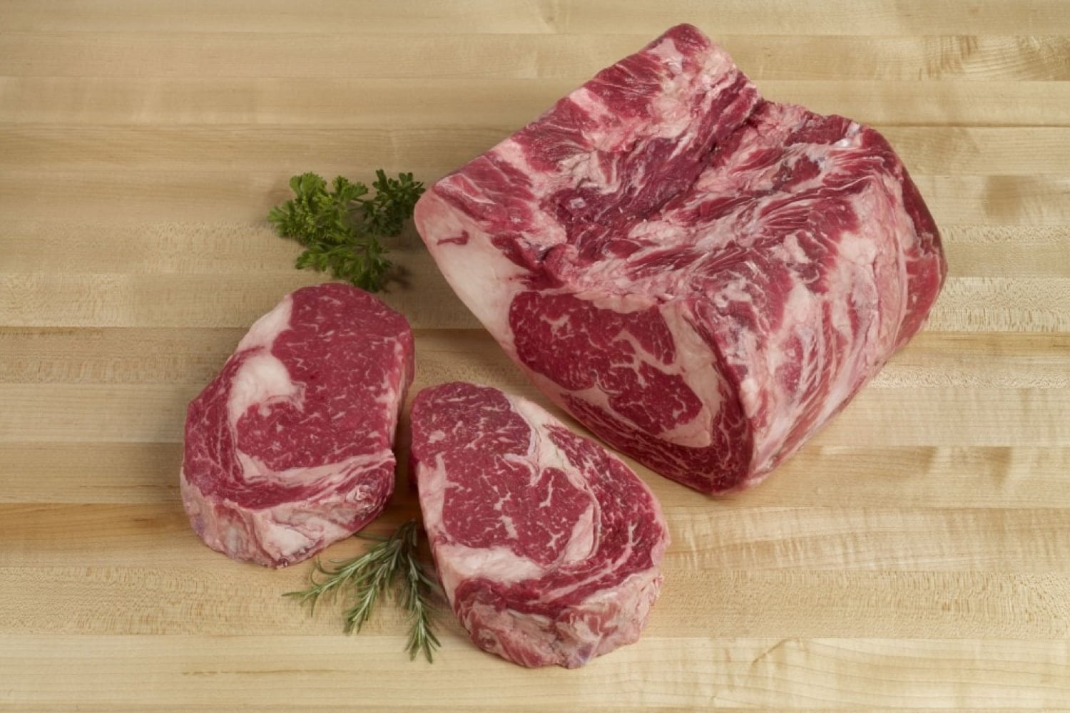 Cut of steak on a wooden table