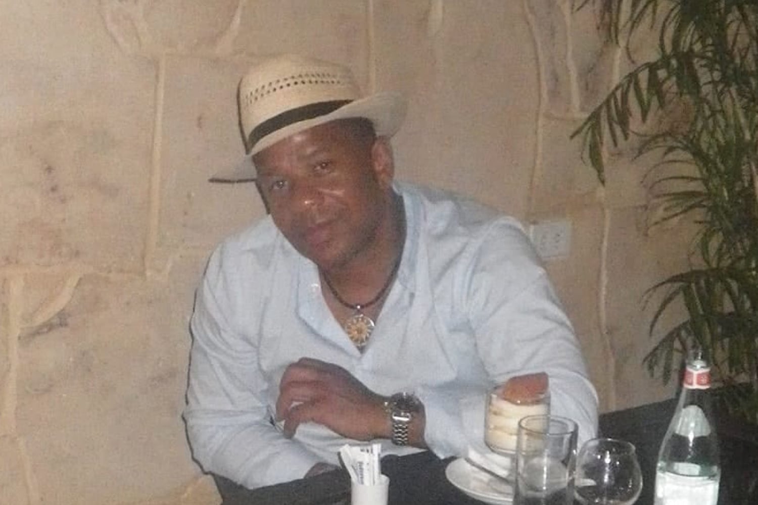 Ridge Produce sales manager, Jose Monch, smiling at a dining table