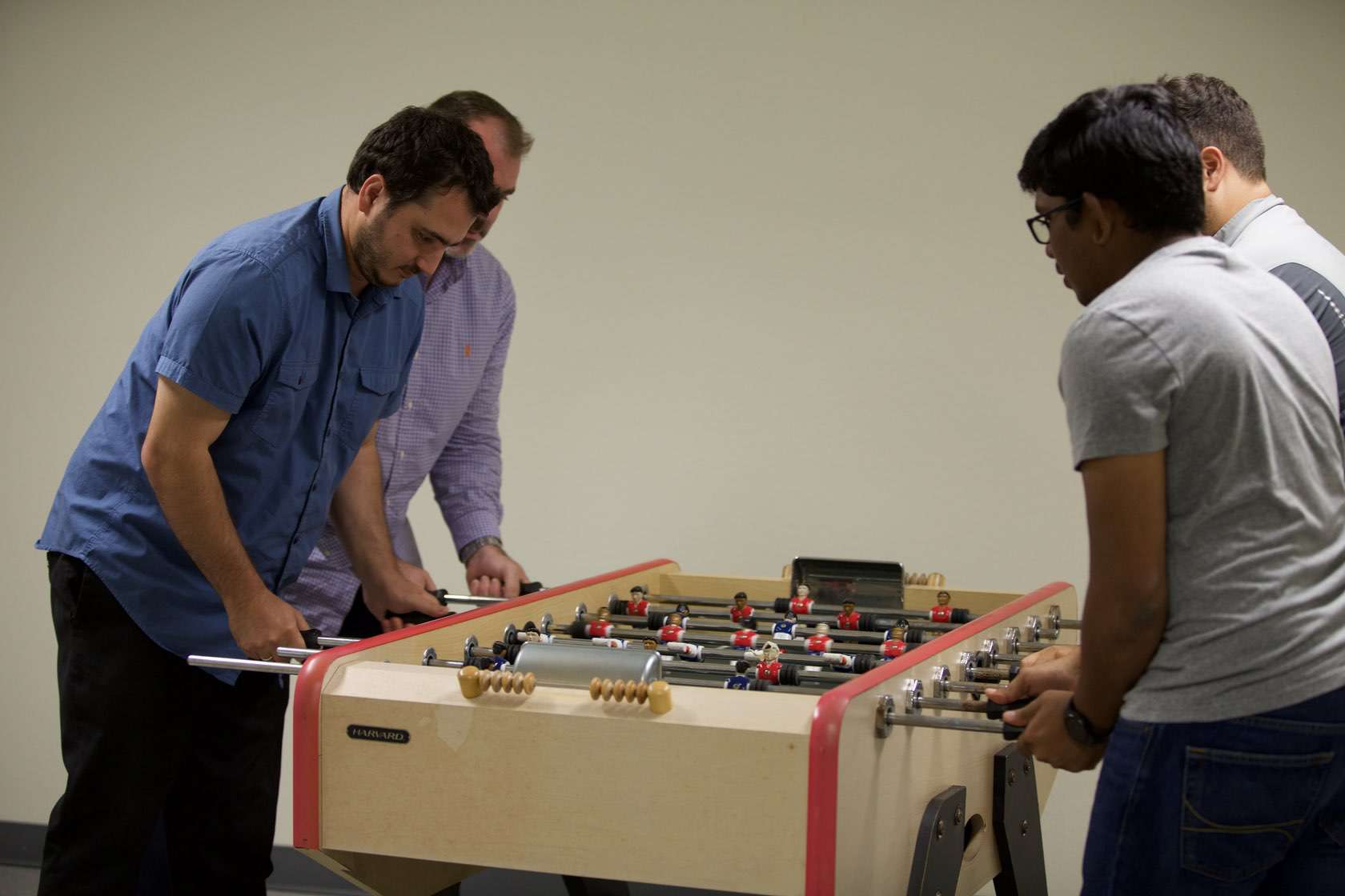 BlueCart employees playing foosball